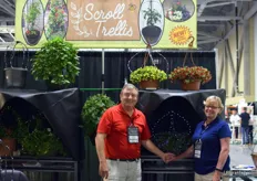 "Larry and Diane McMurray of Scroll Trellis. In the back the new "All-in-One Hanger and Trellis" for hanging baskets and the second is called the “Latch-on-Pot Trellis” for patio pots. For more information on this trellis, see: www.floraldaily.com/article/16235/US-New-trellis-adds- value-night-and-day."
