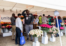 Christopher Makomere of United Selections talking with visitors.