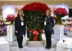 Amy Desperito and Mily Iglesias of Natural Flowers standing next to the Freedom red rose with a hight of ove 6 feet. This Colombian farm, that is primarily a rose grower and known for Freedom, has offices in the US, Hapan and Russia. The US is their main market and according to Iglesias, they are leading in hand tied bouquets.