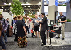 Magician attracts the attention of the visitors.