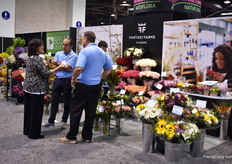 The team of Fantasy Farms talking with a visitor. 