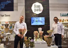 Olaf Amende and Thomas Leithe of Weber Verpackungen presenting their new and potential products in the bloomguard range. Leithe is holding the paper sleeve for lettuce and Amende the sleeve made out of a transparent glassine paper. "The consumer wants to see the flowers and with glassine paper on the top, the consumer can still see the flower and no plastic is used. So far, they received positive reactions, and they will now test how it will work in practice. Amende has high expectations particularly when used to sleeve mono bunches.