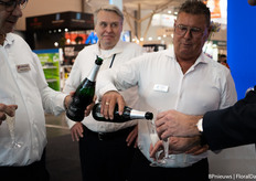 Nico Luiten pours the glasses full of champagne