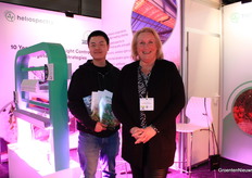 Kevin Oei and Wendy Marijnissen stand next to Heliospectra's MITRA X and DYNA C9