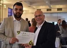 Dennis van der Leijde is showing the certificate of being an official member of the Kazakhstan greenhouse association.