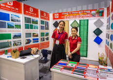 Truong Quynh Cam Tuyen and Kim with Sny Vina, offering textiles for agriculture.