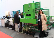 Violeta Ruiz Gonzales next to the Paper Pot 2.0 of the Blackmor Company. https://www.hortidaily.com/article/9699204/filling-three-pots-at-a-time-increases-production-line-capacity-up-to-1200-pots-or-250-trays-an-hour/