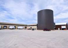 Two hot water storage tanks enable the boilers to burn in the most efficient way. The heath is stored in one of these buffers that can hold 2 million gallons of water each. From there the hot water is pumped to the radiation pipes in the greenhouses.