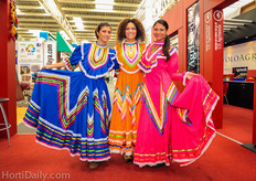 Colorful ladies amongst colorful products at US Agriseeds.