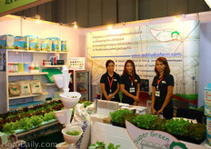 Julalak Chucksasri, Onuma Bhakaeo and Anchalee Luelon of Ack International Co., LTD surrounded by their hydroponic systems.