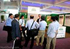 Luciën Knetemann explaining about Glasimport Greenhouses to several Asian guests.