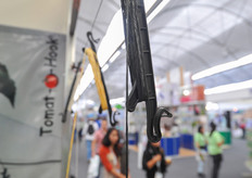 Showcasing plastic tomato hooks at the tipo booth.