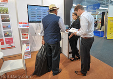 Ben Sosef and Emily Middendorp from Royal Brinkman welcoming a Mexican grower at their booth.