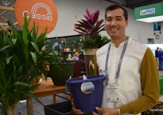 Jon Vaugan with CTI Living  is showing a pot made of ocean bound plastic waste.
