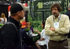 John Hoffman with Hoffman Nursery, in conversation with a visitor. Hoffman Nursery specializes in ornamental and native grass liners for the wholesale trade.