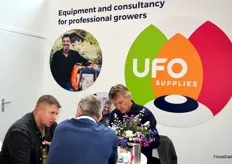Jans de bruin en John de Wit with UFO supplies talking to Marios Sifakis from Sifakis.  Don't you think their new logo looks great?!!