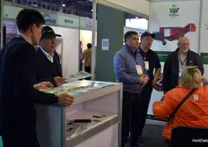 At the Gunsa Makine booth they’re all looking at the promotional video, of their machines, like the soil mixer and potting machines.