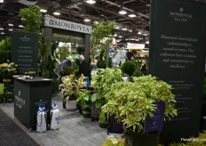 The Monrovia booth covered in plants.