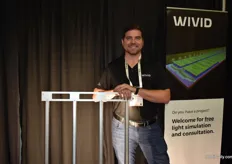 Patrick Carroll with Wivid holding the SLIM, the small propagation light