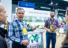 Brad Blaas and Nick McCov with Westerlay Orchids are talking to customers on how to make watering of their orchids easier for growers