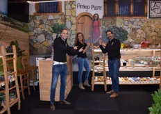 Amigo Plants, represented by Rick, Nicole and Jacco, together pointing to a photo of Nicole dressed in a traditional Portuguese dress