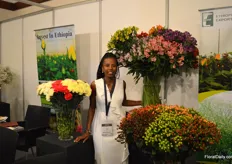 Aline Musine of Green Horizon next to their alstroemerias, also on display at the booth of EHPEA.