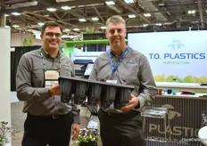 James Rowley and Scott Klein with T.O. {;astics presenting the SureRoot 15 Pop Bottom. This tray makes it easier to take out plgs or young plants, without damaging the plant.