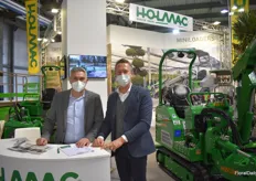 Luca Montolli and Marco Quaglio with Holmac's machines in the background.